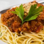 Tasty spaghetti bolognese with a vegetarian minced meat of seitan and tomato sauce